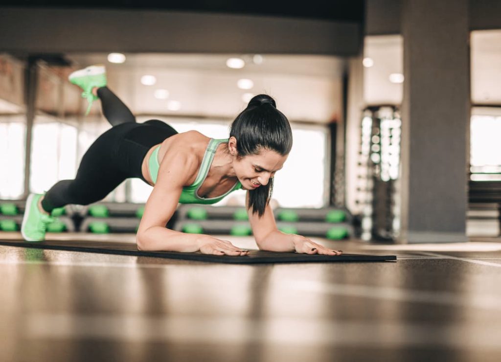 athletic woman doing exercise on mat 2023 11 27 04 56 24 utc (1)