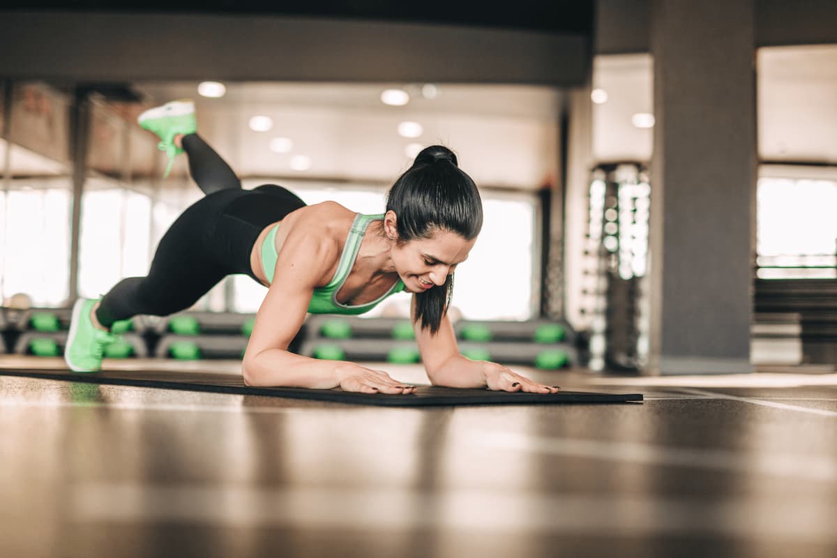 athletic woman doing exercise on mat 2023 11 27 04 56 24 utc (1)