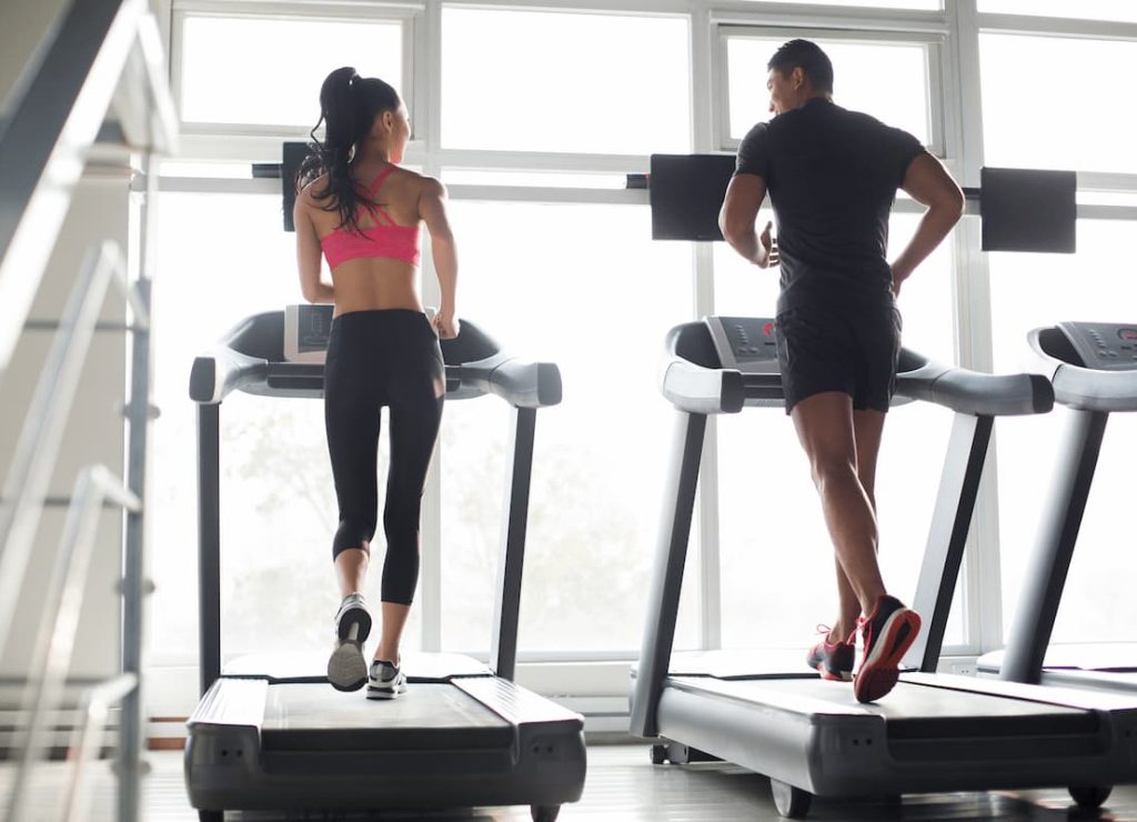 young couple exercising on treadmills in gym 2024 10 16 22 00 26 utc (1)