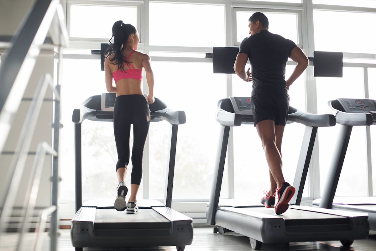 young couple exercising on treadmills in gym 2024 10 16 22 00 26 utc (1)